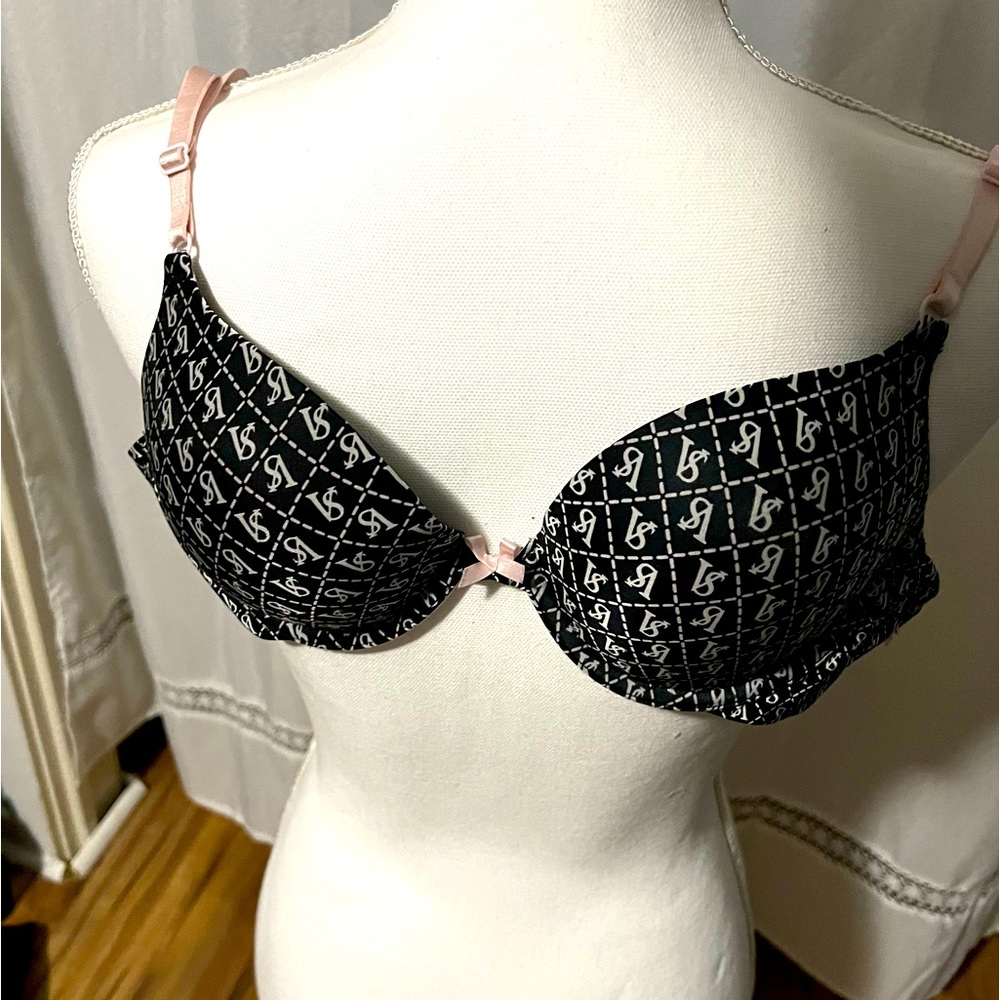 Victoria’s Secret black bra white VS symbols